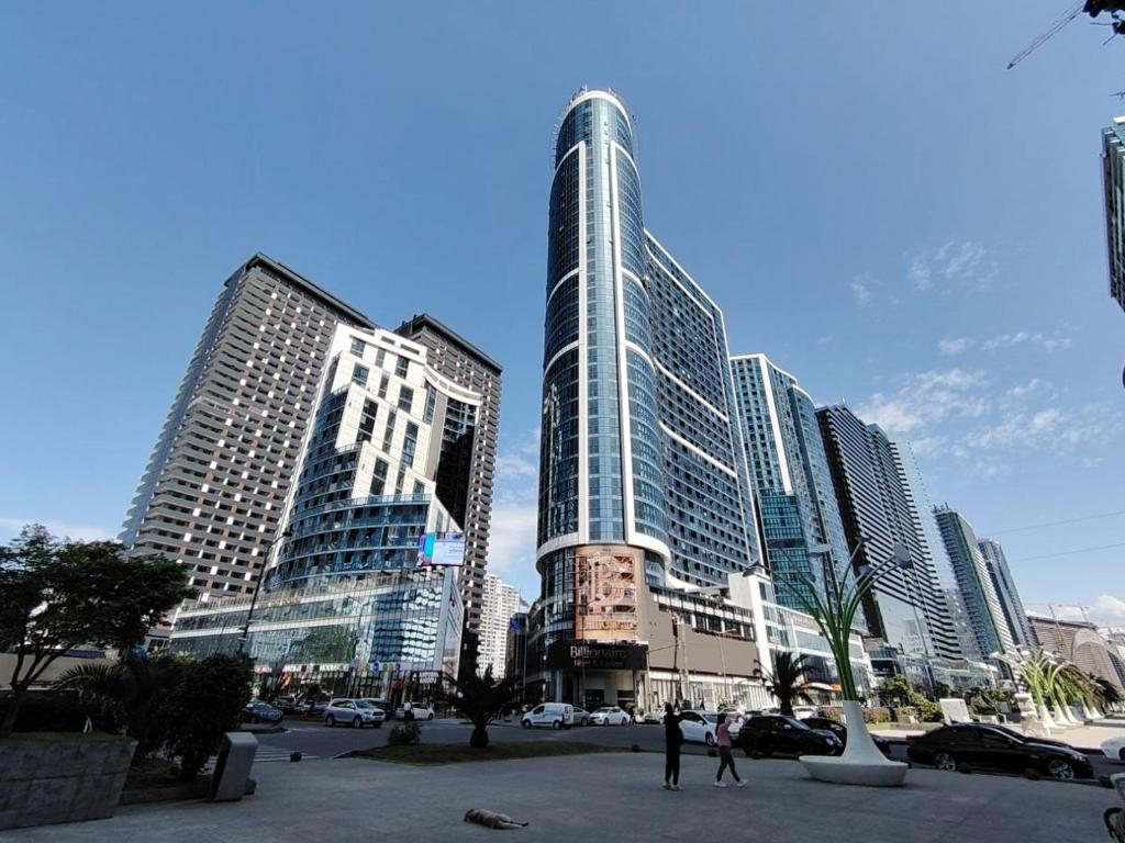 a group of tall buildings in a city at Grand Marina Apartments Batumi in Batumi