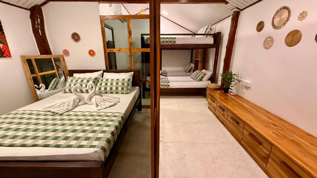 Postel nebo postele na pokoji v ubytování Arcadia villas Arugambay
