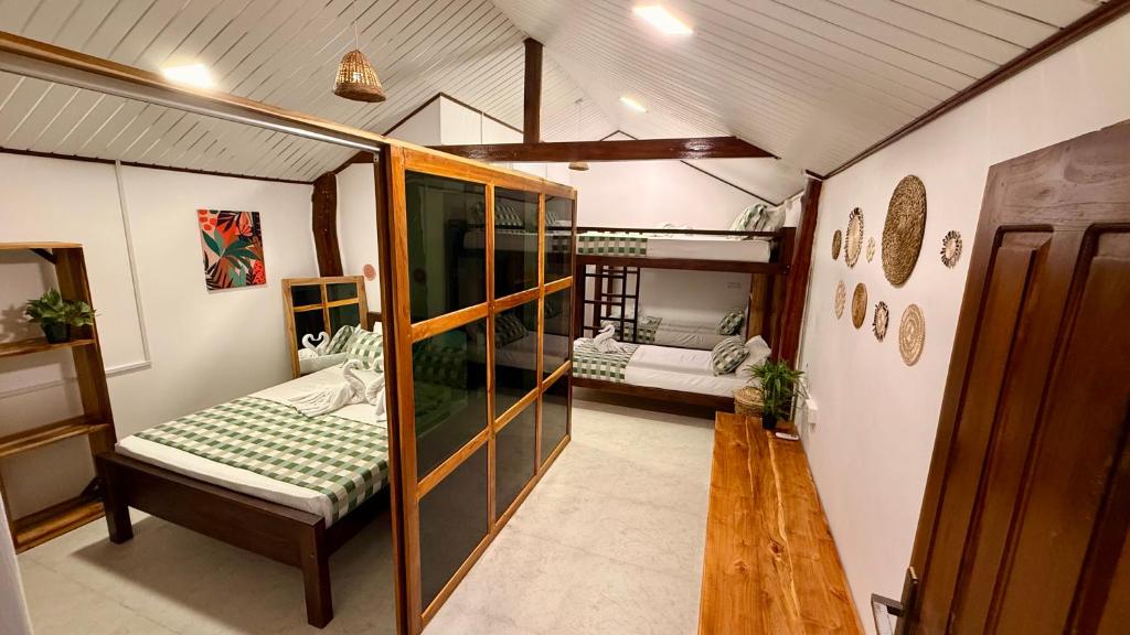 Postel nebo postele na pokoji v ubytování Arcadia villas Arugambay