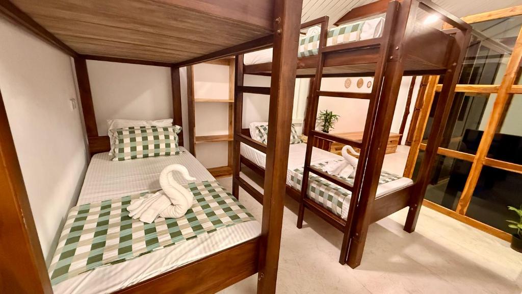 Postel nebo postele na pokoji v ubytování Arcadia villas Arugambay