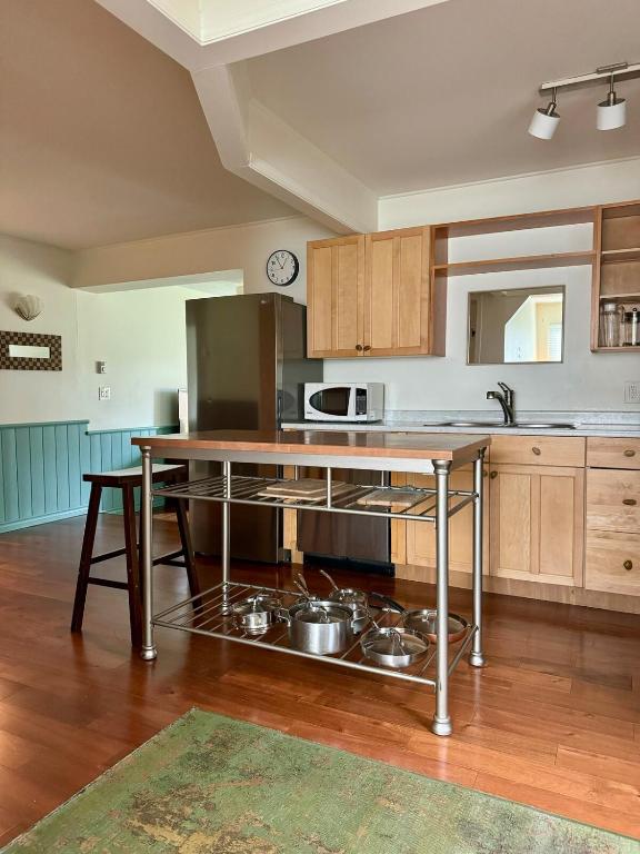 a kitchen with a counter with pots and pans at Blue Cypress in Tofino