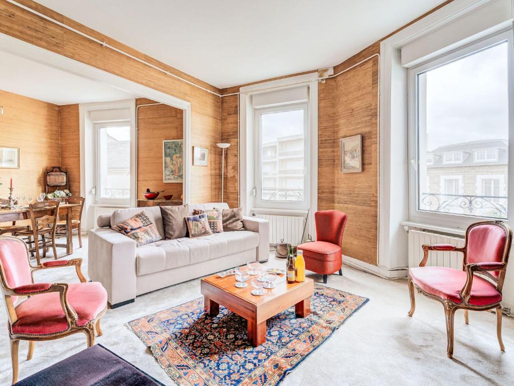 a living room with a couch and chairs and a table at Apartment L'écluse-3 by Interhome in Dinard