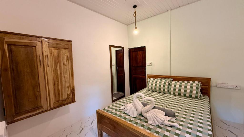Postel nebo postele na pokoji v ubytování Arcadia villas Arugambay