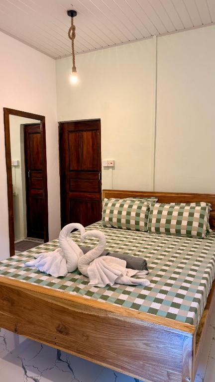 Postel nebo postele na pokoji v ubytování Arcadia villas Arugambay