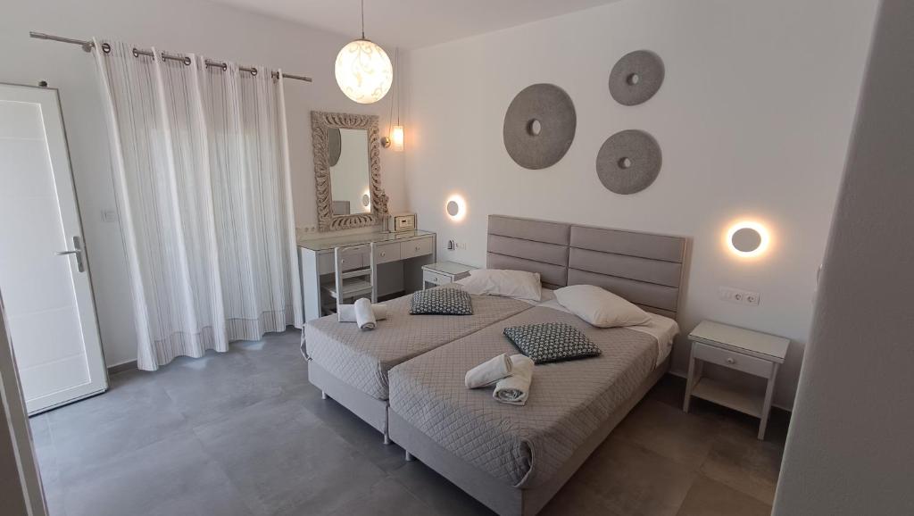 Postel nebo postele na pokoji v ubytování Cyclades Studios