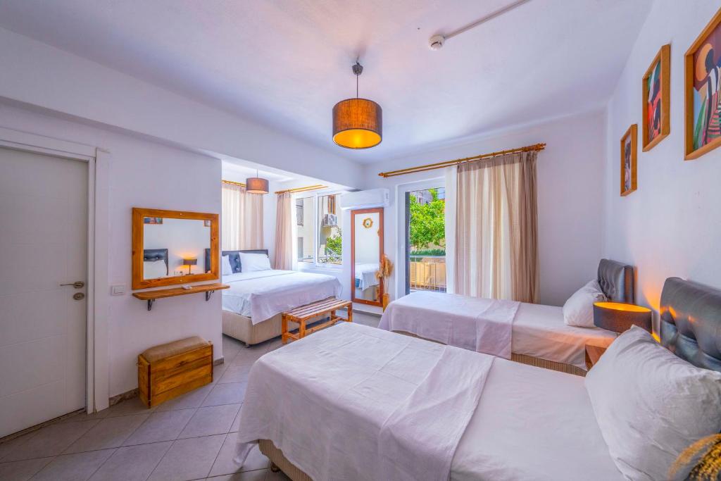 Postel nebo postele na pokoji v ubytování Larex Otel