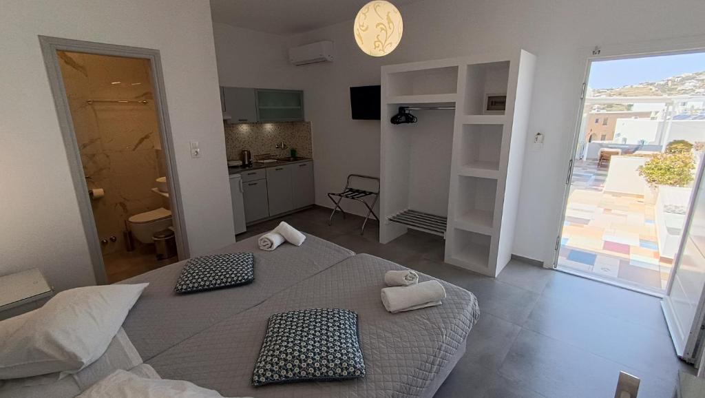 Postel nebo postele na pokoji v ubytování Cyclades Studios