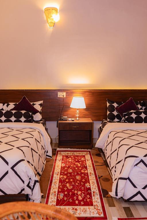 Voodi või voodid majutusasutuse Busy Bee Resort, Pokhara toas