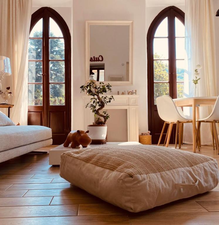 a bedroom with a large bed and a table at Contessa Reina in Como