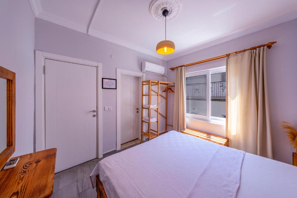 Postel nebo postele na pokoji v ubytování Larex Otel