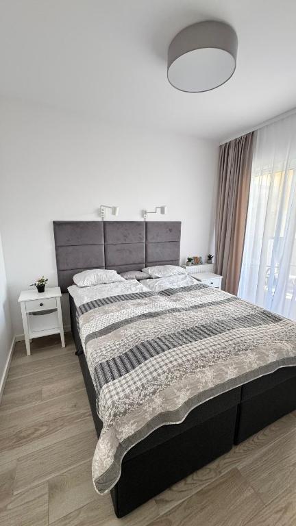 Posteľ alebo postele v izbe v ubytovaní Apartament GreyAppart