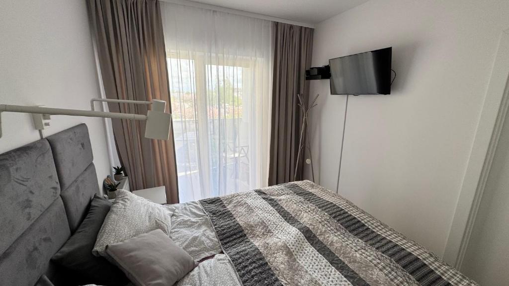 Posteľ alebo postele v izbe v ubytovaní Apartament GreyAppart