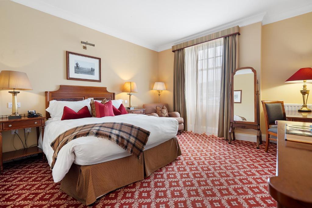 Postel nebo postele na pokoji v ubytování The Ugadale Hotel