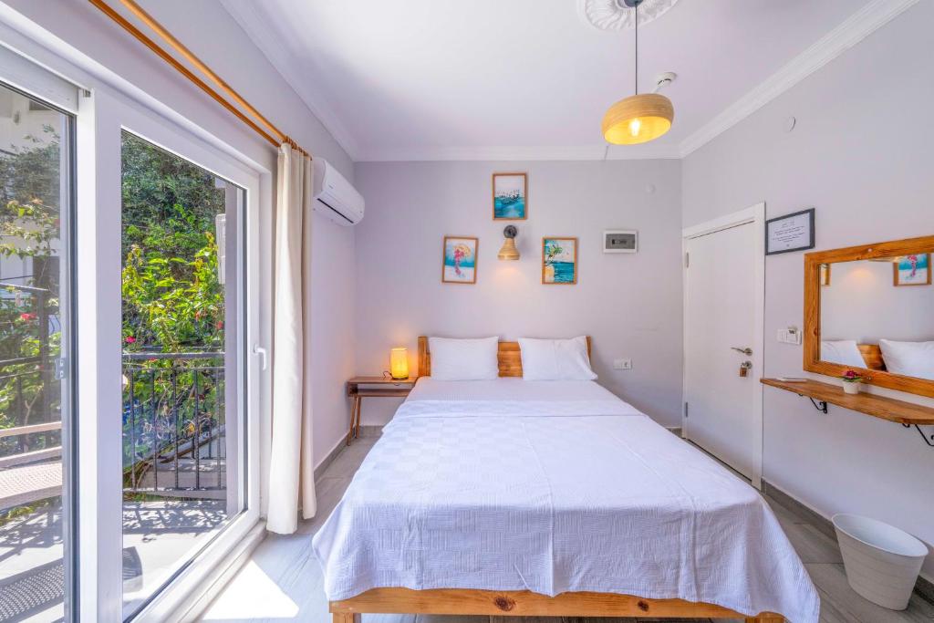Postel nebo postele na pokoji v ubytování Larex Otel