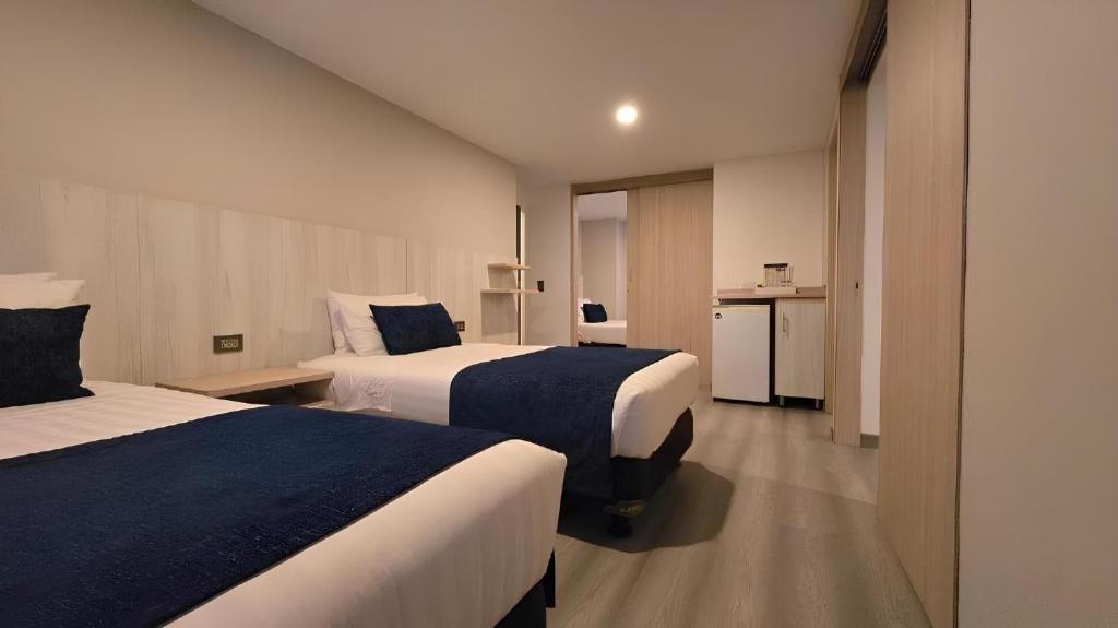 Postel nebo postele na pokoji v ubytování Hotel Confort 80 Zona Rosa