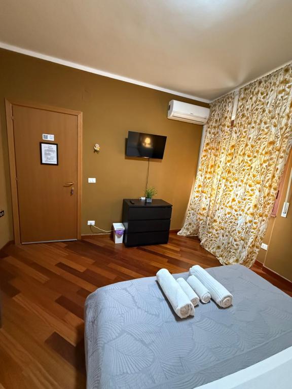 Postel nebo postele na pokoji v ubytování Nirvana House Pisa