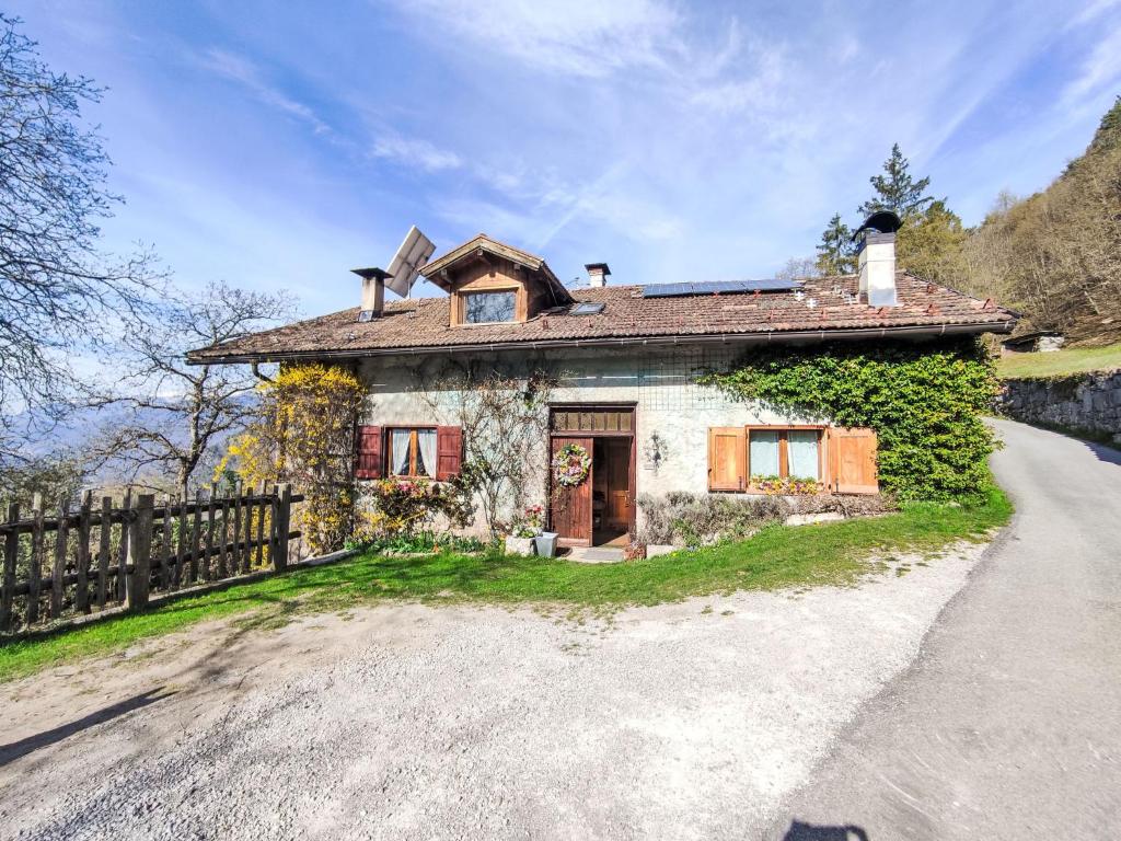 a small house on the side of a road at Chalet Baita Ballardini by Interhome in Ragoli