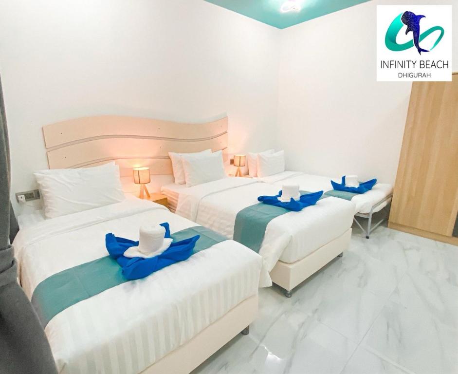 Postel nebo postele na pokoji v ubytování Infinity Beach Dhigurah