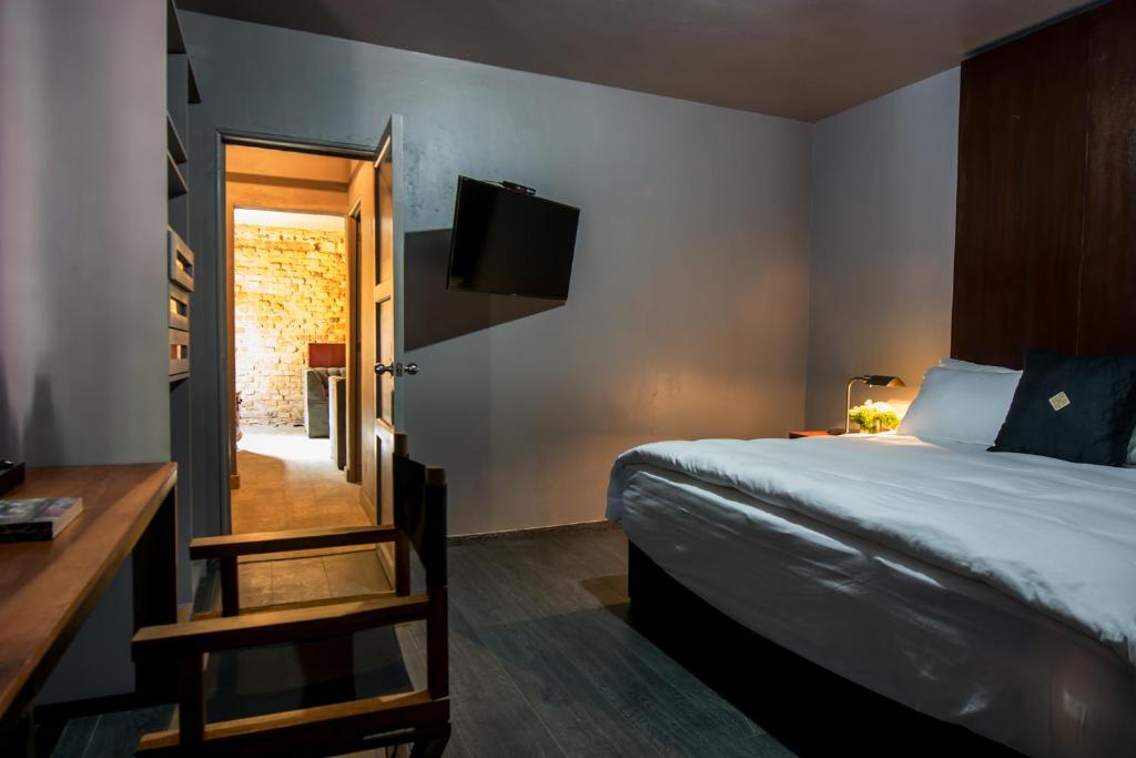 Postel nebo postele na pokoji v ubytování Bungalows Demetria