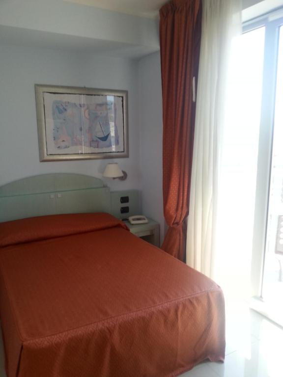 Postel nebo postele na pokoji v ubytování Hotel Eden Gigli