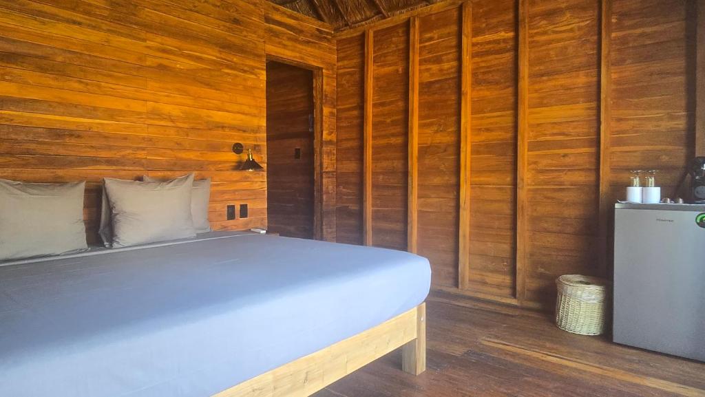 Postel nebo postele na pokoji v ubytování Playa Laguna Bacalar Beach Front