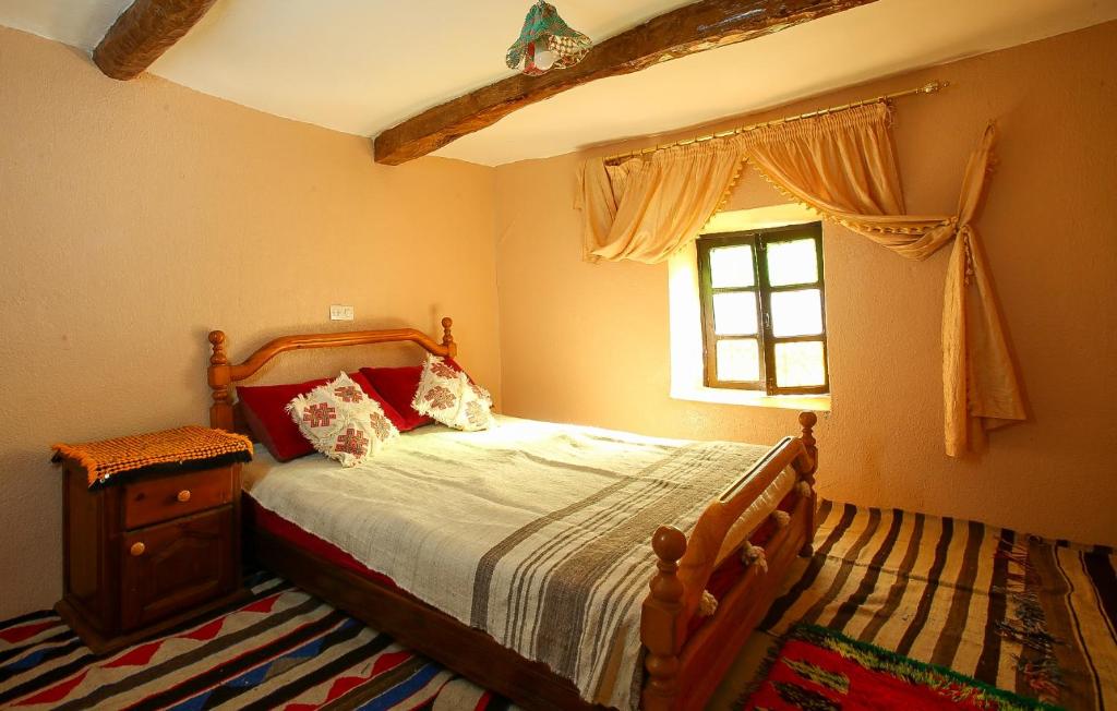 Postel nebo postele na pokoji v ubytování Adrar View Lodge
