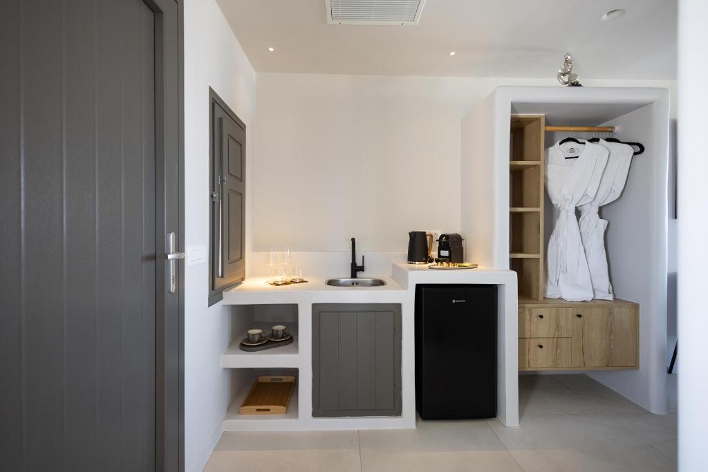 Kuchyň nebo kuchyňský kout v ubytování Niabelon Suites