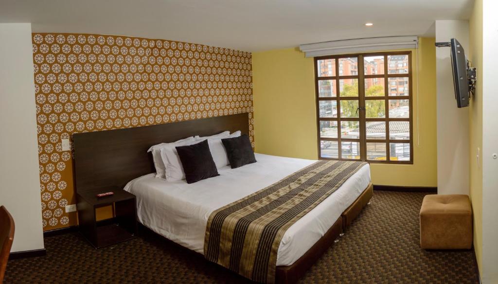 Postel nebo postele na pokoji v ubytování Castellana 95 Bogota By Hoteles Confort 80