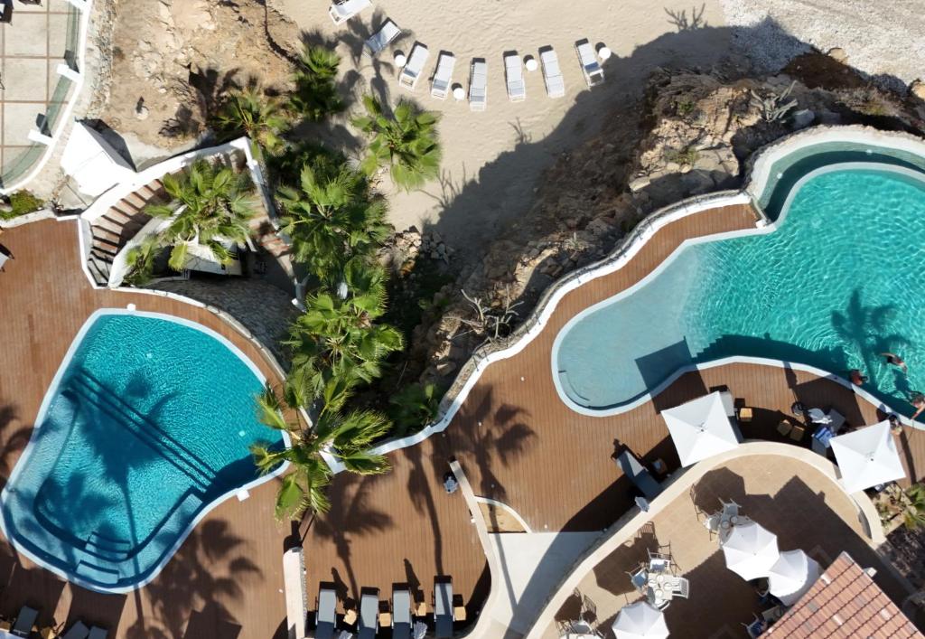 an aerial view of a resort with a swimming pool at Punta Pescadero Paradise Hotel & Villas in Los Barriles