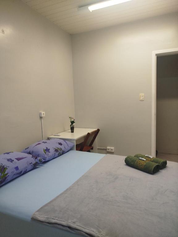 Postel nebo postele na pokoji v ubytování Pousada Central Quarto 2