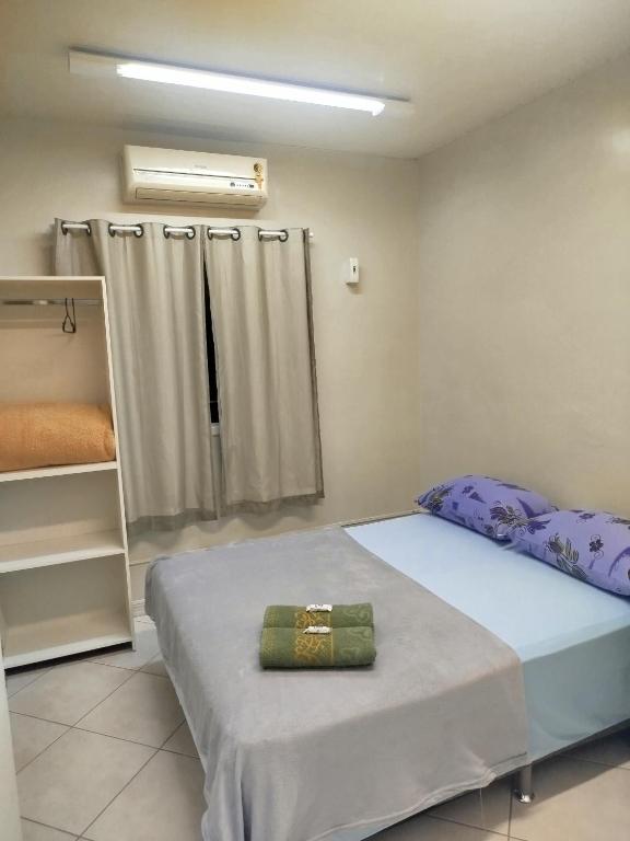 Postel nebo postele na pokoji v ubytování Pousada Central Quarto 2