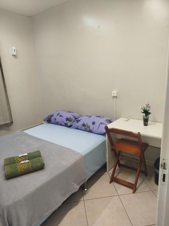 Postel nebo postele na pokoji v ubytování Pousada Central Quarto 2