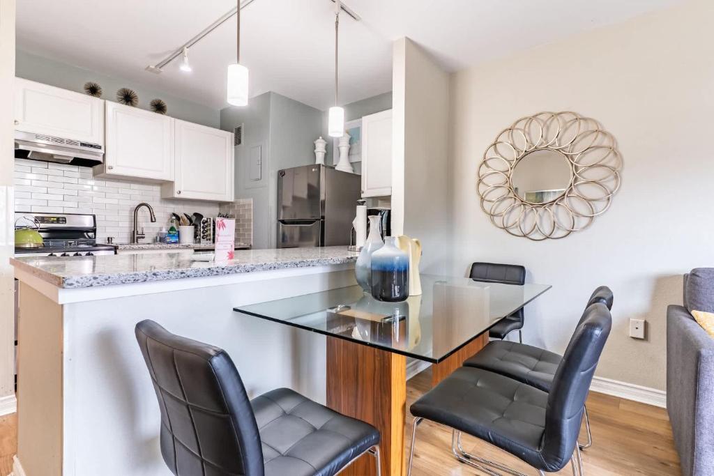 a kitchen with a table and two chairs at Eclectic Downtown & Cap Hill King bed & Kitchen in Seattle