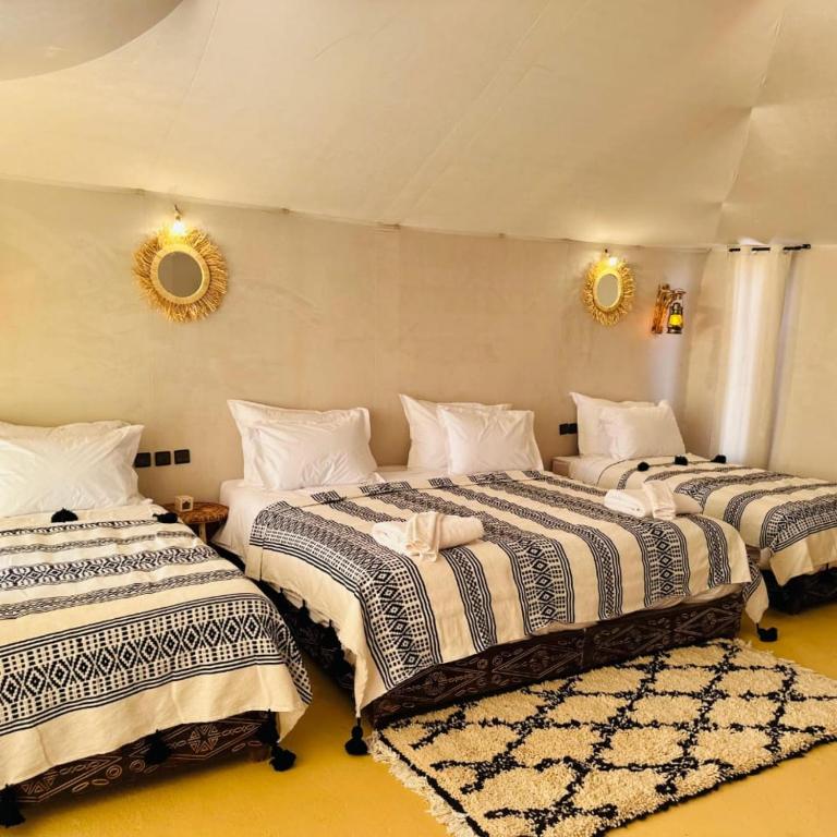 Postel nebo postele na pokoji v ubytování Luxury Trippers Camp