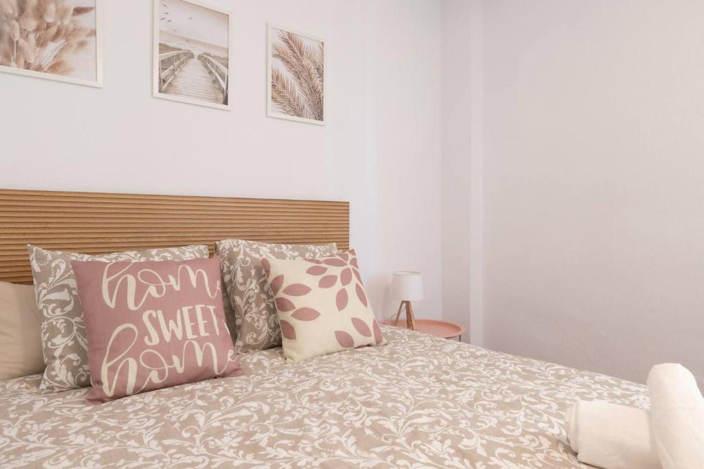 a bedroom with a bed with pillows on it at Casa Sánchez. Old Town Marbella in Marbella