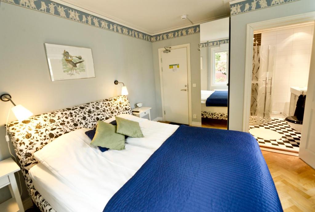 Postel nebo postele na pokoji v ubytování Borgs Villahotell och B&B