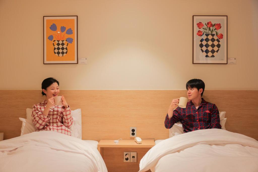 Postel nebo postele na pokoji v ubytování From H Ace Hotel Daejeon by Aank