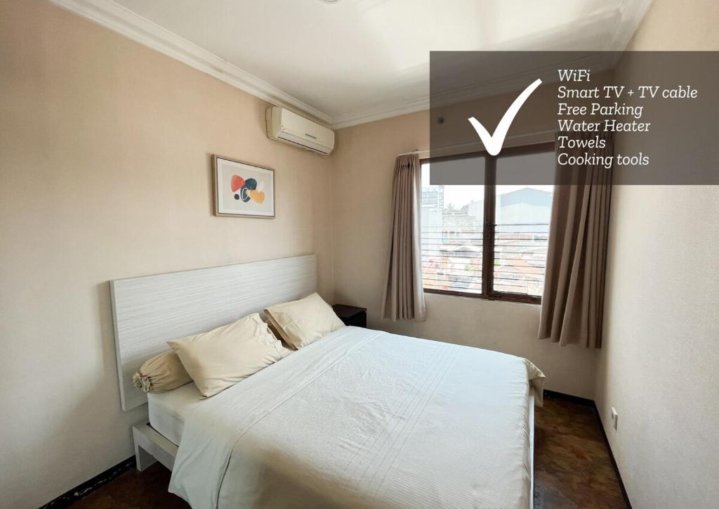 Postel nebo postele na pokoji v ubytování 2BR Comfortable City Center