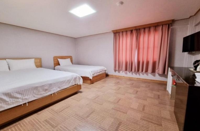 Postel nebo postele na pokoji v ubytování Hotel G