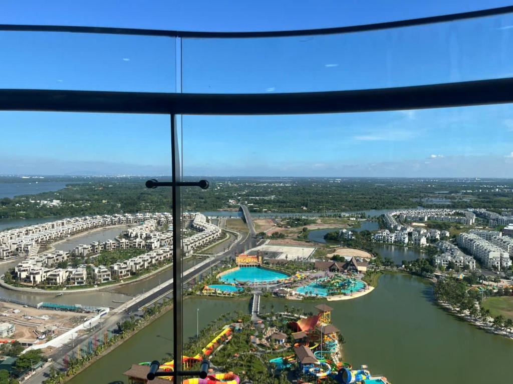 a view of a water park from a window at Honeymon vinhomes grand park - 3 phòng ngủ in Gò Công