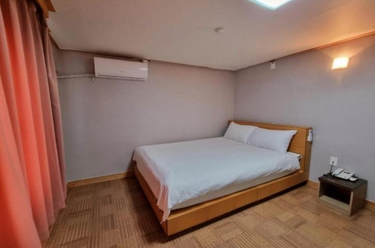 Postel nebo postele na pokoji v ubytování Hotel G