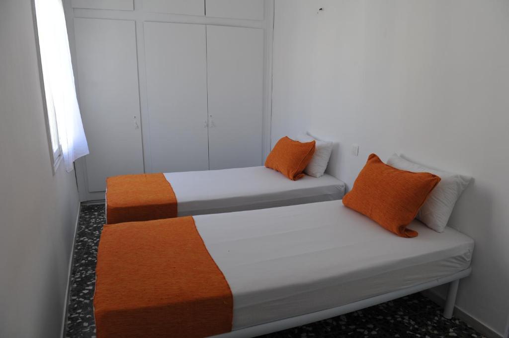 Postel nebo postele na pokoji v ubytování Kalymnos residence