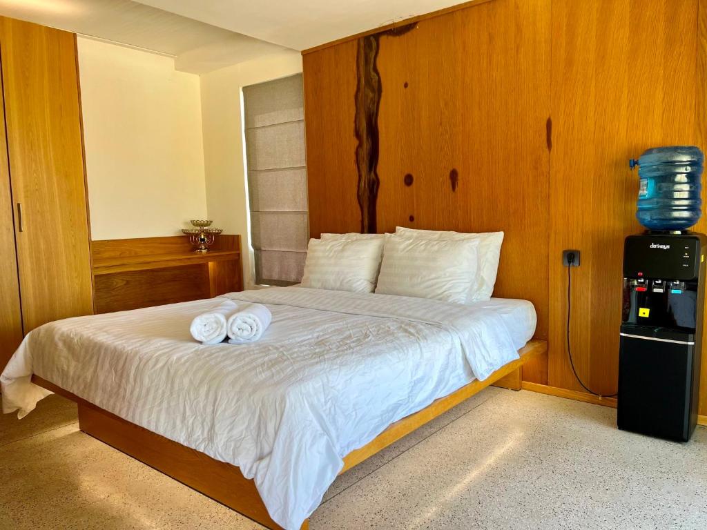 Postel nebo postele na pokoji v ubytování Đất Quảng Villa
