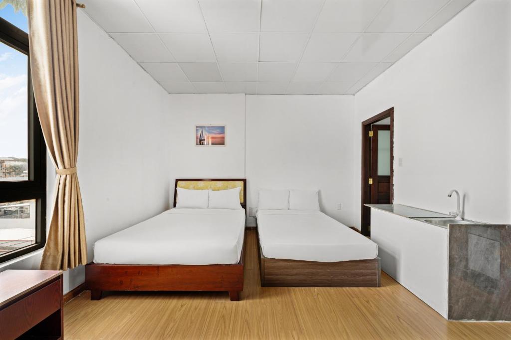 Postel nebo postele na pokoji v ubytování Kis Hotel & Apartment