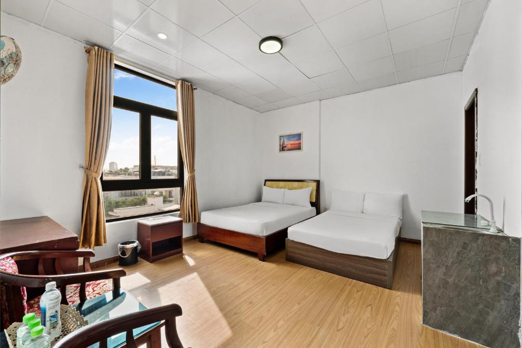 Postel nebo postele na pokoji v ubytování Kis Hotel & Apartment