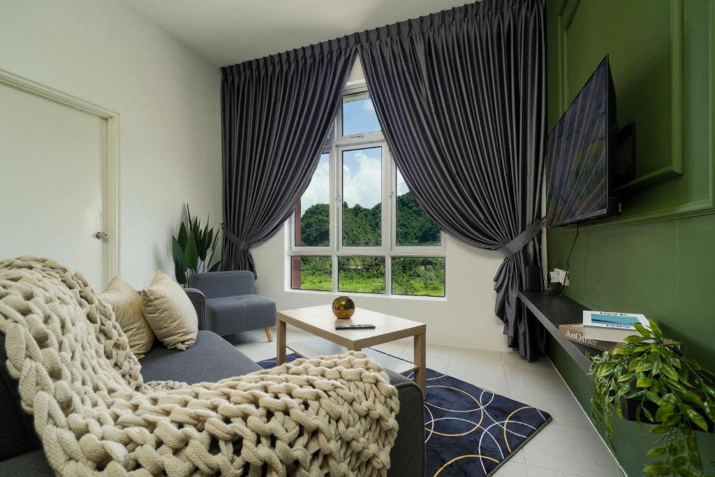 a living room with a chair and a window at Mountain View Suites by Xuites- Anderson Residence-6 pax-Free Netflix-6 mins to Concubine Lane in Ipoh
