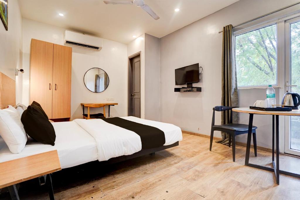 Postel nebo postele na pokoji v ubytování Super Hotel O Britania Chowk