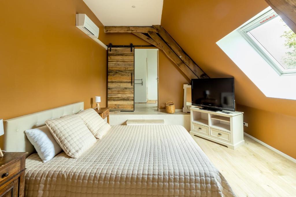 Postel nebo postele na pokoji v ubytování Domaine des grands chênes