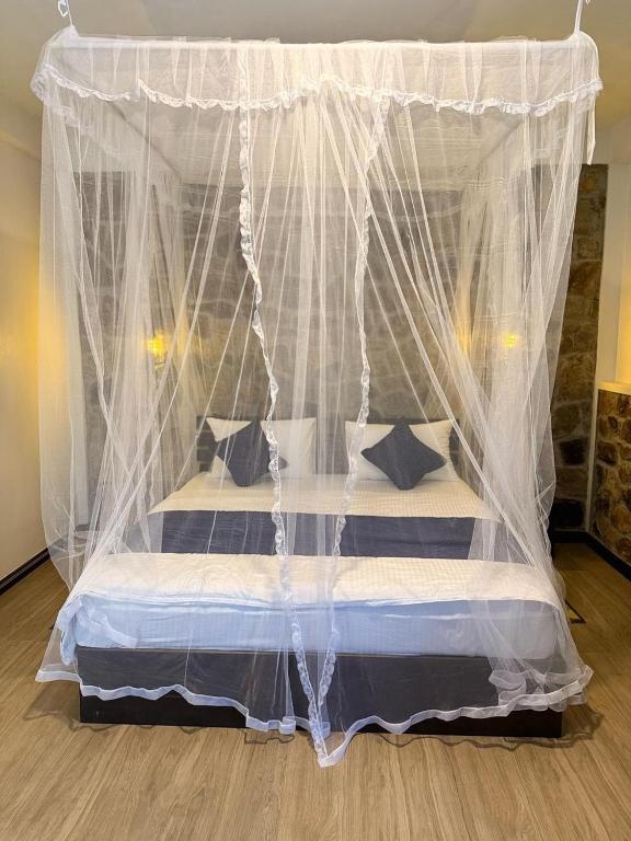 Postel nebo postele na pokoji v ubytování Sky Garden Ella