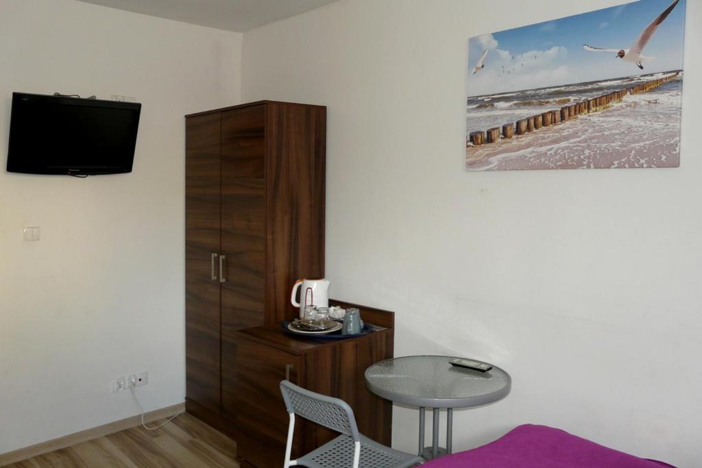 Televízia a/alebo spoločenská miestnosť v ubytovaní Amber House